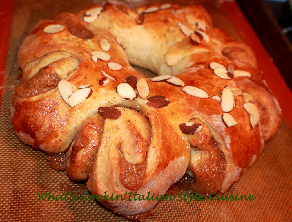 Almond Filled Coffee Cake This is a sweet risen pastry dough filled with almond filling coffee cake with almonds on top and frosting.