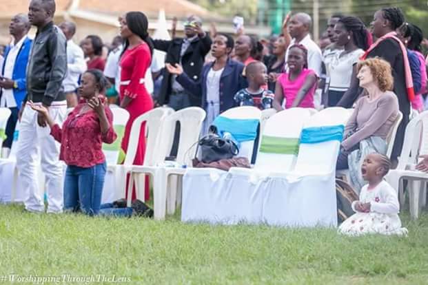 Viral photos of 3-year-old girl on her knees and in tears as she prays and worships God during a church service