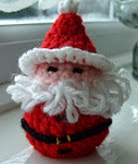 http://www.ravelry.com/patterns/library/santa-chocolate-cover-decoration