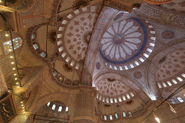 The interior is lit with 260 windows which were once filled with 17th Century stained glass but sadly they were lost and replaced by replicas at Blue Mosque in Sultanahmet Square in Istanbul, Turkey The interior is lit with 260 windows which were once filled with 17th Century stained glass but sadly they were lost and replaced by replicas at Blue Mosque in Sultanahmet Square in Istanbul, Turkey