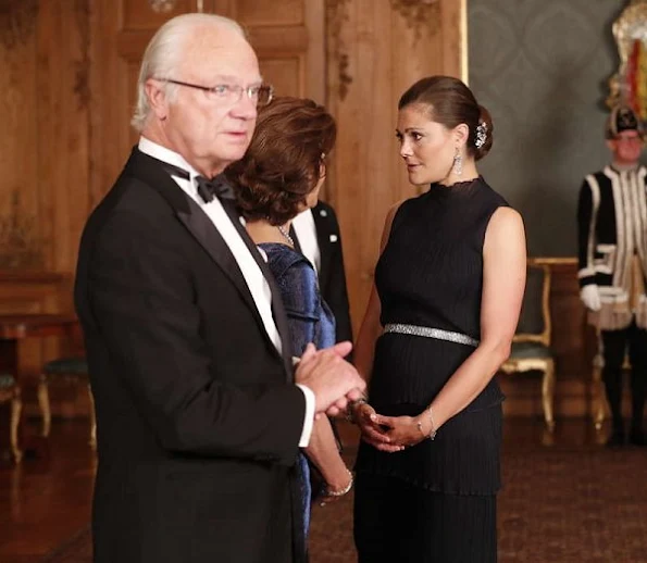 Crown Princess Victoria, Prince Daniel, Prince Carl Philip and Princess Sofia at Sverigemiddag. Princess Victoria wore Ann-Sofie Back dress style dress, gown. Crown Princess Victoria wore Ann-Sofie Back gown, Princess Sofia wore Kay Senchai gown