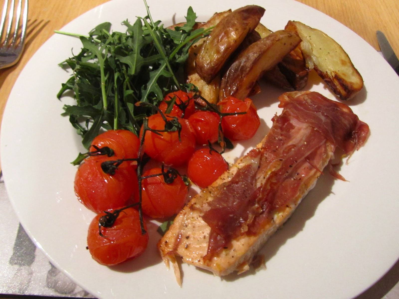 Baked Salmon with Parma Ham and Roasted Vine Tomatoes