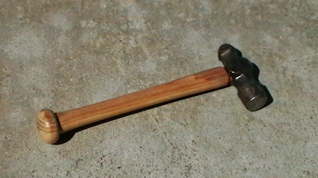 Baseball bat hammer handle with clear coat.