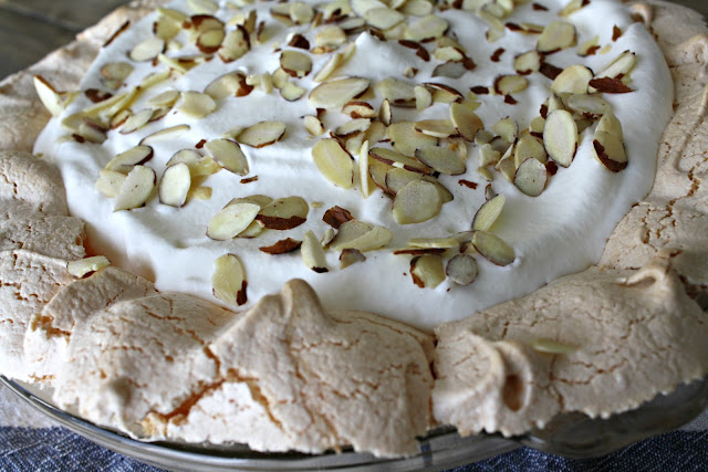 A piece of cake covered in almonds