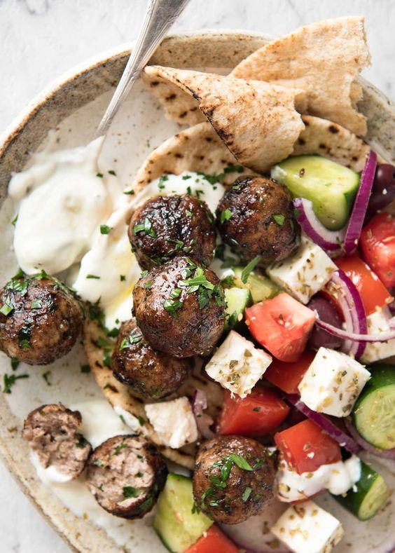 Juicy Greek Meatballs (Keftedes), beautifully flavoured with red onion, parsley, a hint of mint and dried oregano with a slightly crispy surface. See recipe video below.