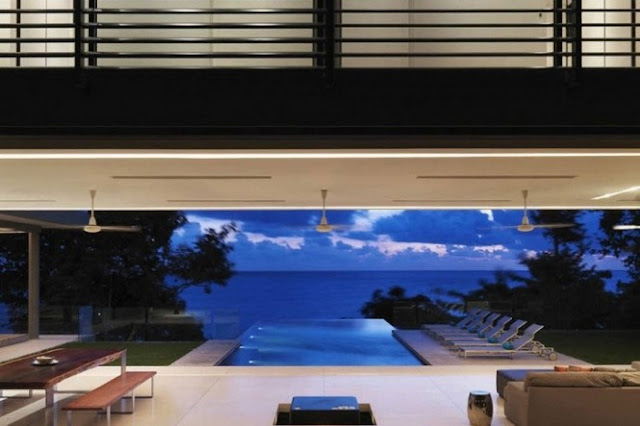 Photo of dusk ocean view from the living room of modern villa
