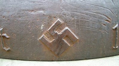 Olympic bell then and now. swastika eagle