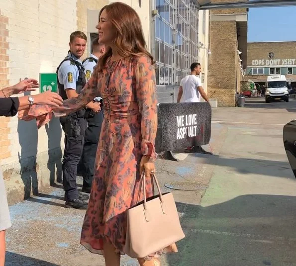 Crown Princess Mary wore a printed silk midi dress by H&M and Prada pumps, she carried Prada Saffiano cuir double bag