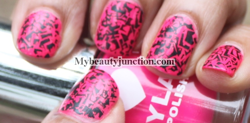 Manicure: Shocking pink Layla Cosmetics nail polish with black