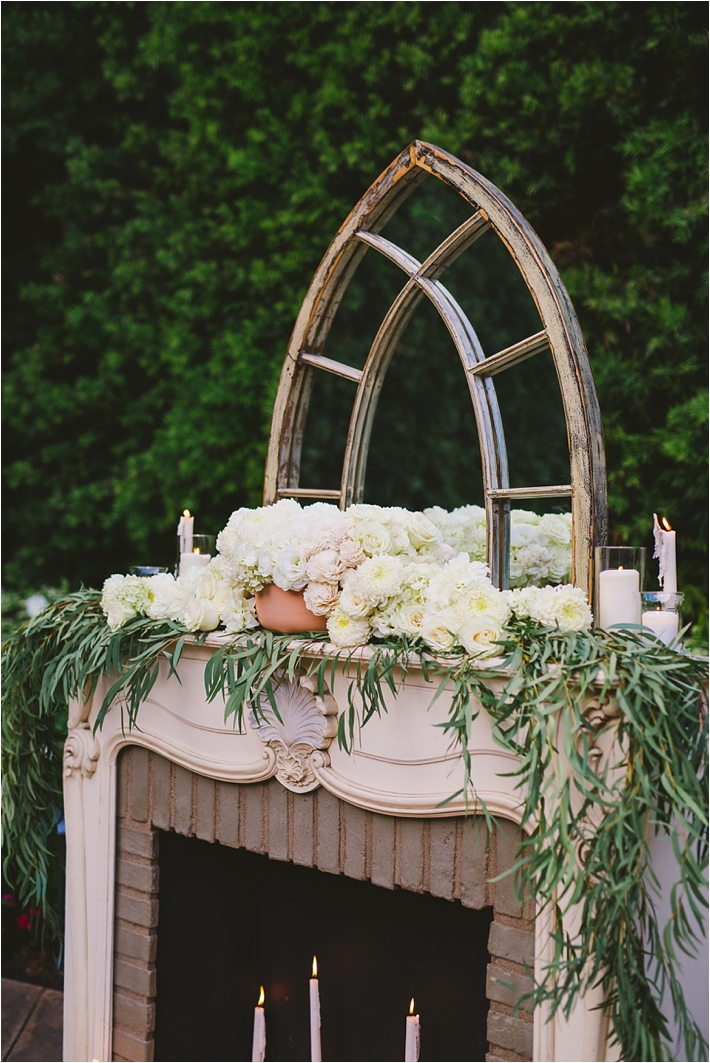 Fireplace Ceremony Altar with flowers and candles via @thesocalbride