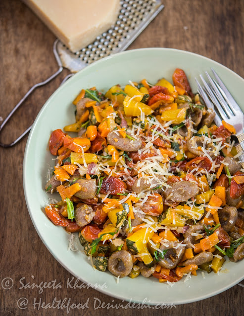 whole grain pasta with pumpkin carrots and cherry tomatoes 