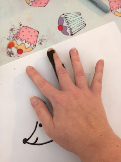 Hand print being made on to paper