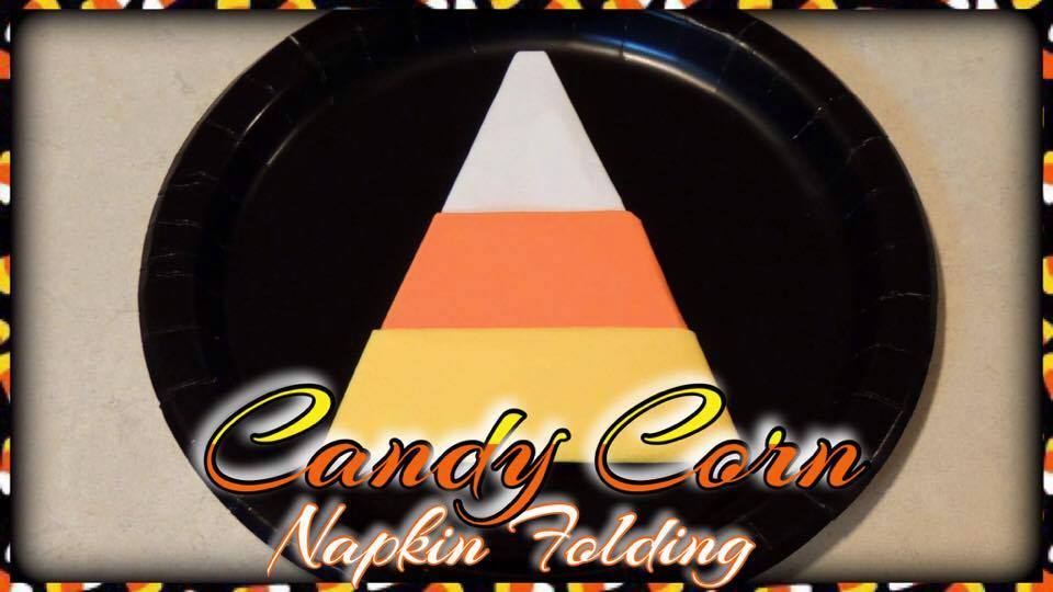 this candy corn napkin fold is quick and easy for a fun halloween table setting