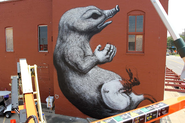 While we last heard from him in San Juan, Puerto Rico, ROA has now reached Arkansas and the lovely city of Fort Smith for the Unexpected Festival which is curated by JustKids.