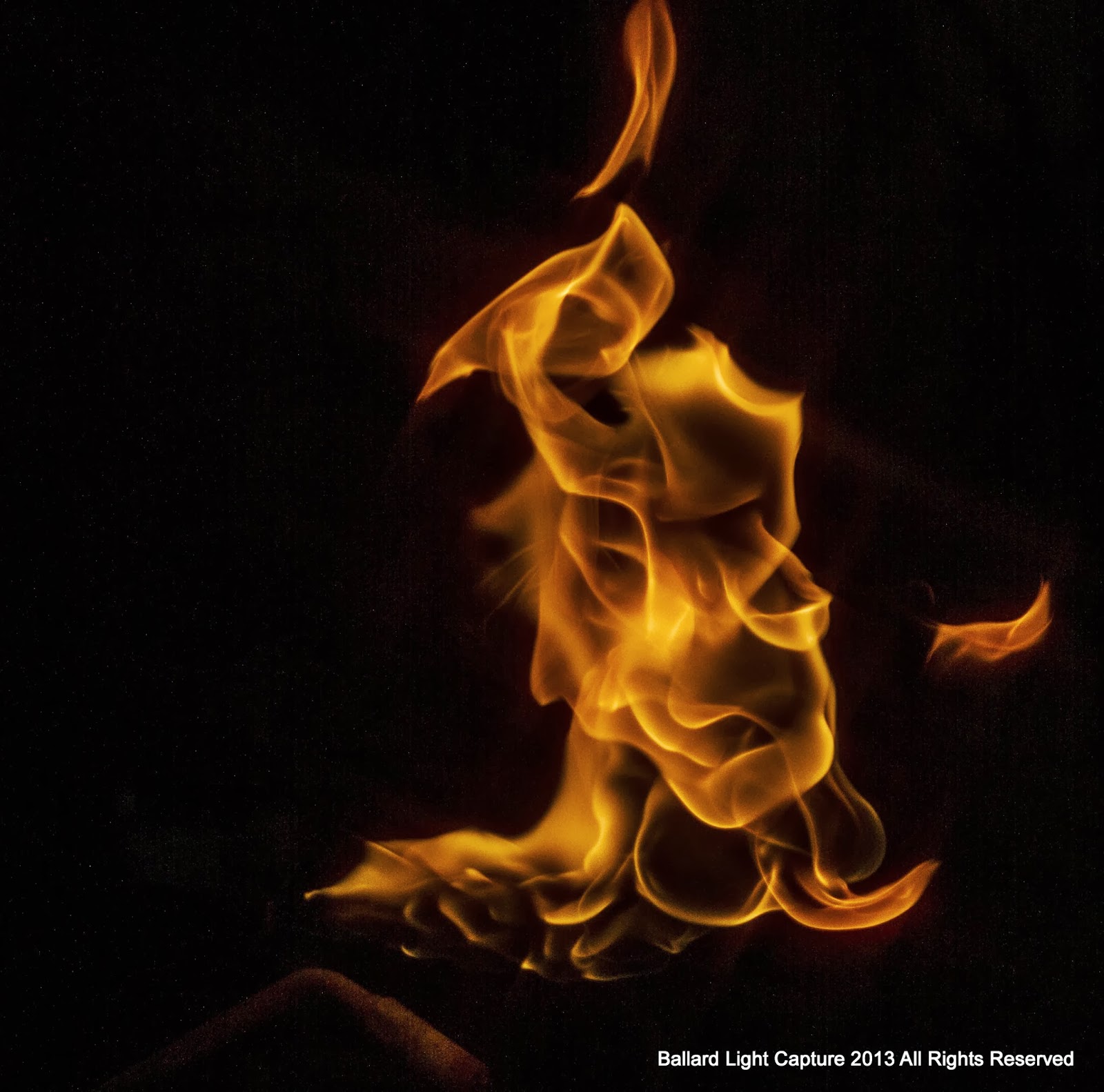 Ballard Light Capture Man Stares At Fire, Fire looks Back