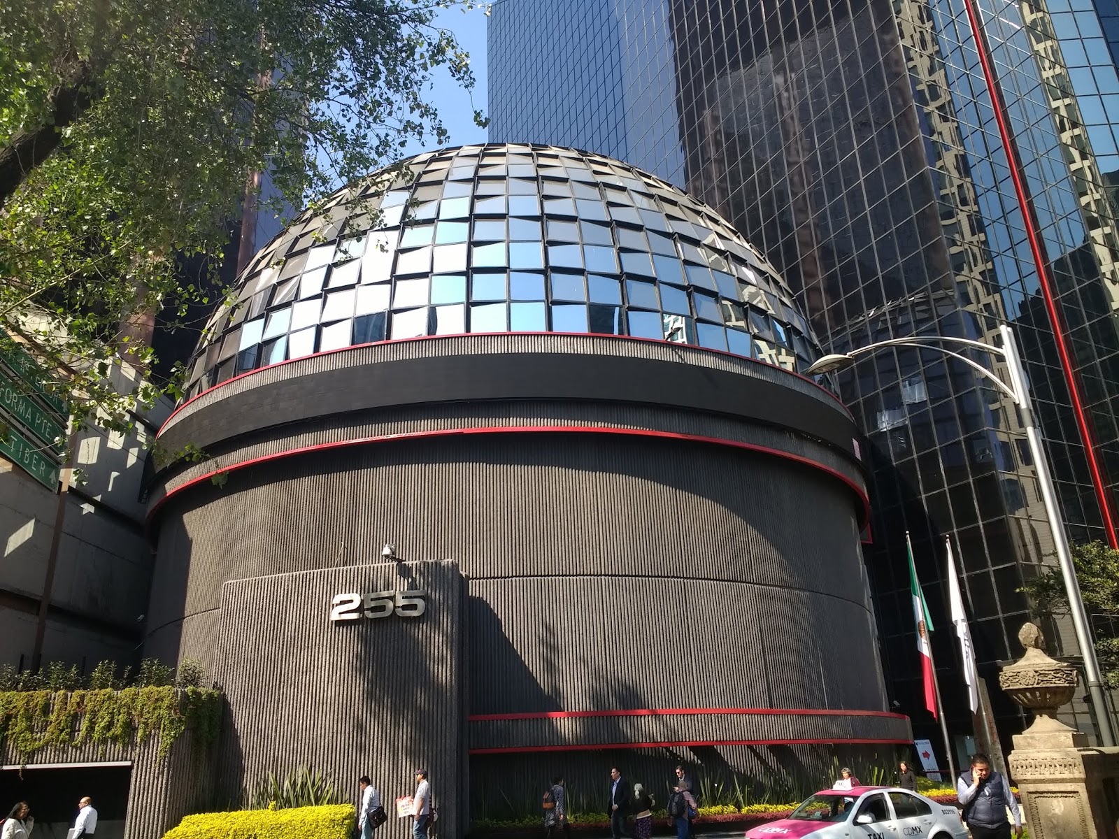 the mirror ball building in front of a futuristic pencil thin building comprised the city s bolsa de valores or stock exchange the mirror ball building in front of a futuristic pencil thin building comprised the city s bolsa de valores or stock exchange