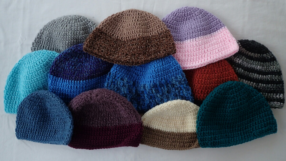 AdventureLisa Handing out beanies at Mponeng Primary