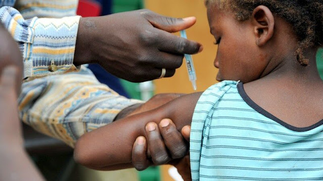 Child being vaccinated in Nigeria