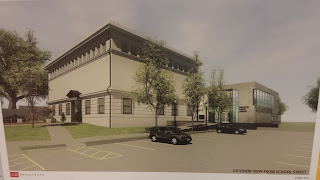 a rendering of the outside of the building showing the expansion on the back corner