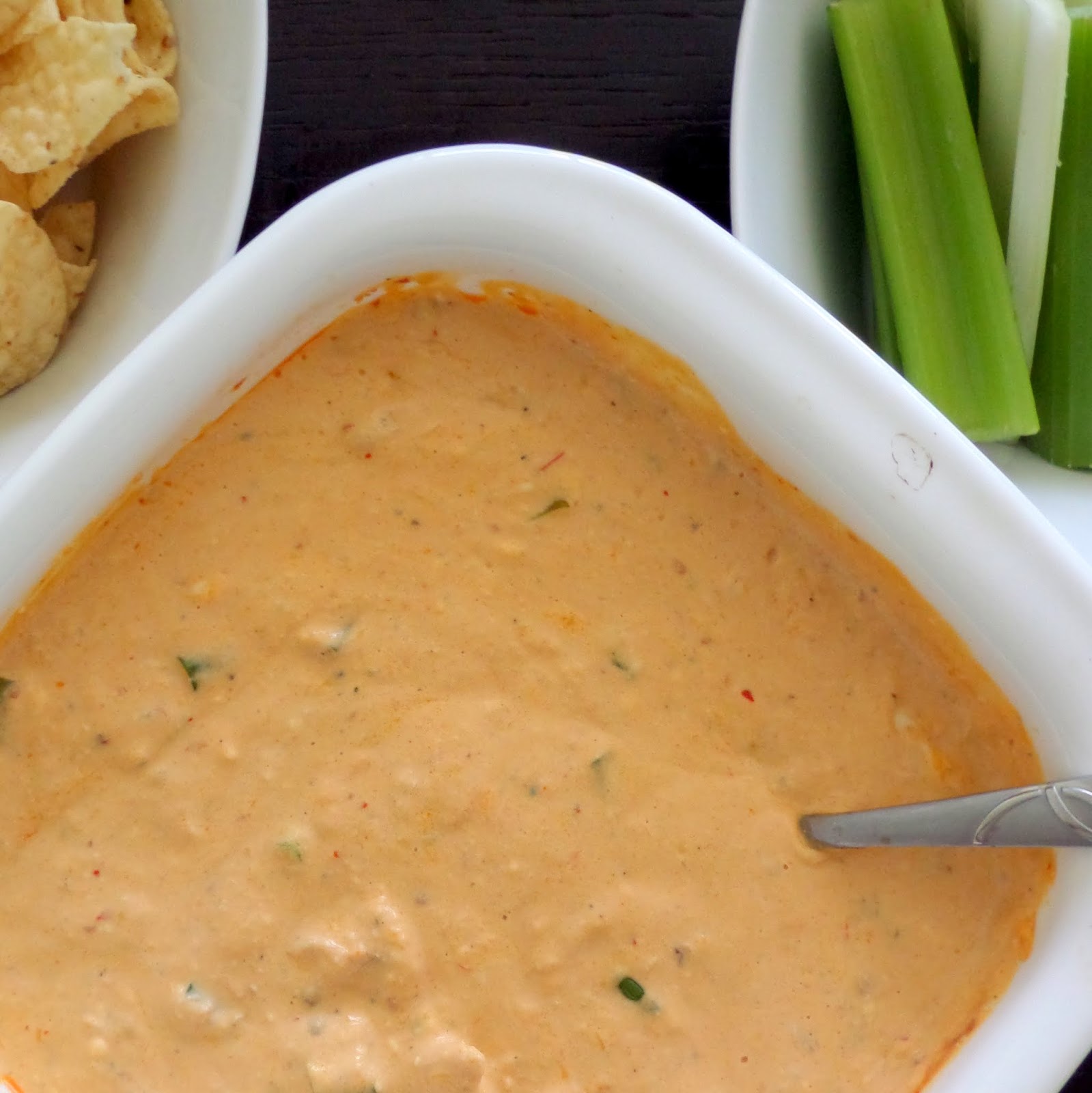 Blue Cheese Buffalo Chicken Dip:  A warm and spicy dip made with cream cheese, sour cream, blue cheese, chicken, and buffalo sauce.