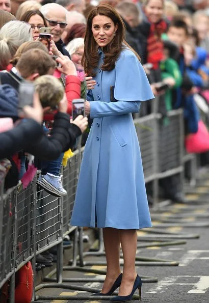 Kate Middleton wore Mulberry blue Ashleigh cape coat and a new Jenny Packham dress.The Duchess is wearing a cape coat by Mulberry