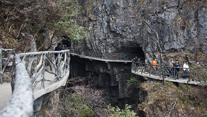 Jutting out from a sheer cliff 1,430 meters high, the glass skywalk in Zhangjiajie National Forest Park offers sightseers terrifying thrills and clear view of the mountains below as they tread nervously across the 60 meter long bridge encircling the vertical cliffs of Tianmen Mountain in Hunan province. The 3ft-wide, 2.5in thick glass walkway is so scary that sightseers are requested to wear cloth slip-ons over their shoes when they cross the skywalk, presumably to make the job easier for the cleaners.