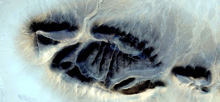 Allegory of fossil footprint alien in the African desert,photography of abstract landscapes of deserts of Africa from the air, Munimara Collection of Abstract Naturalism,forms of stone in the desert Allegory of fossil footprint alien in the African desert,photography of abstract landscapes of deserts of Africa from the air,