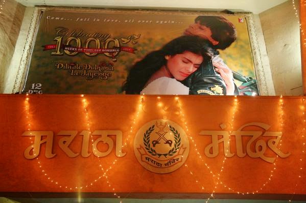 Shahrukh Khan and Kajol in DDLJ poster at Maratha Mandir Theater DDLJ aka Dilwale Dulhania Le Jayenge movie poster featuring Shahrukh Khan and Kajol at Maratha Mandir Theater