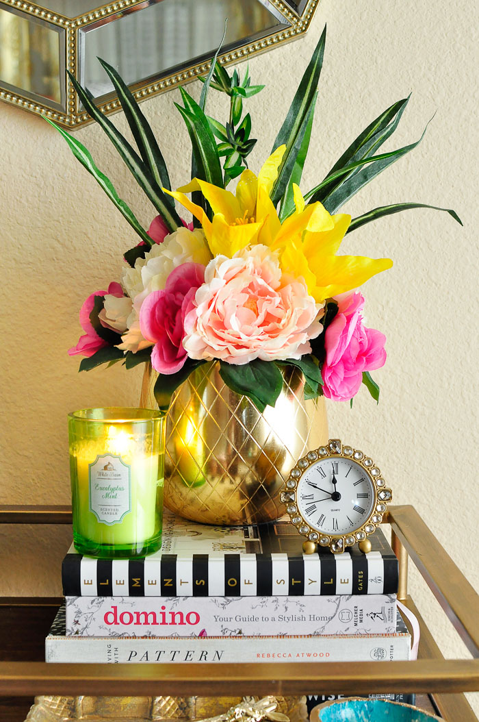 Ideas for how to use dollar store or Dollar Tree florals to create chic floral arrangements and home decor.