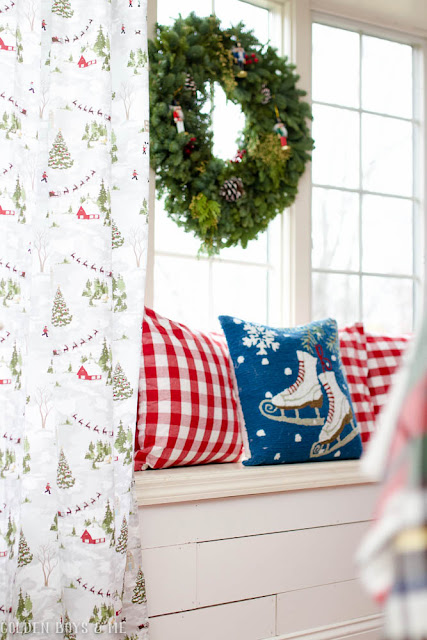 Tablecloth with winter village used as curtains with Christmas window seat