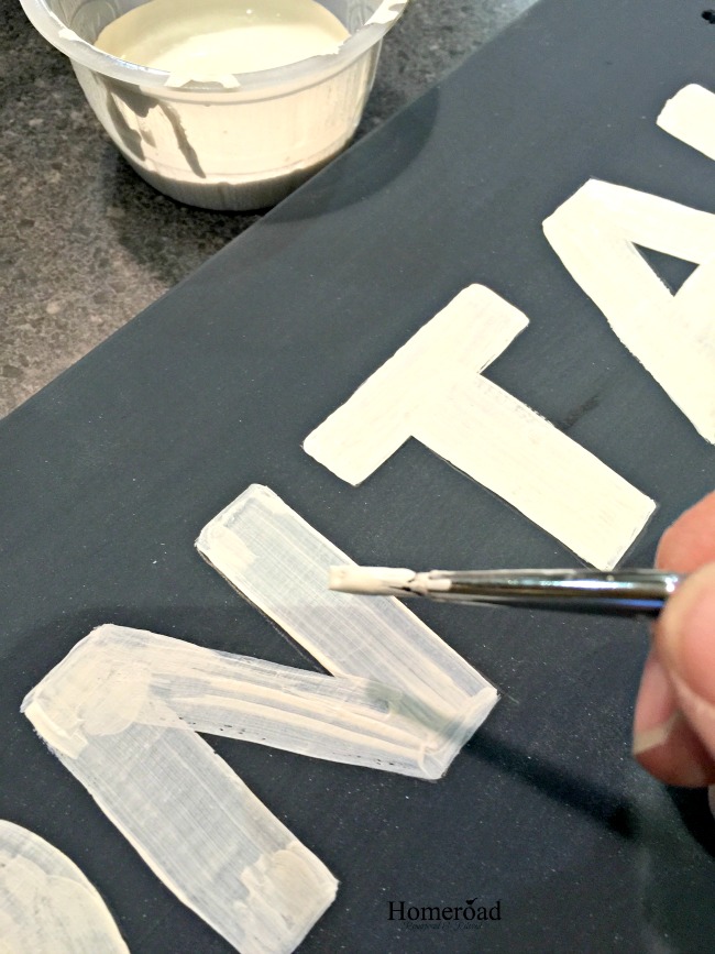 Painting white letters on navy blue