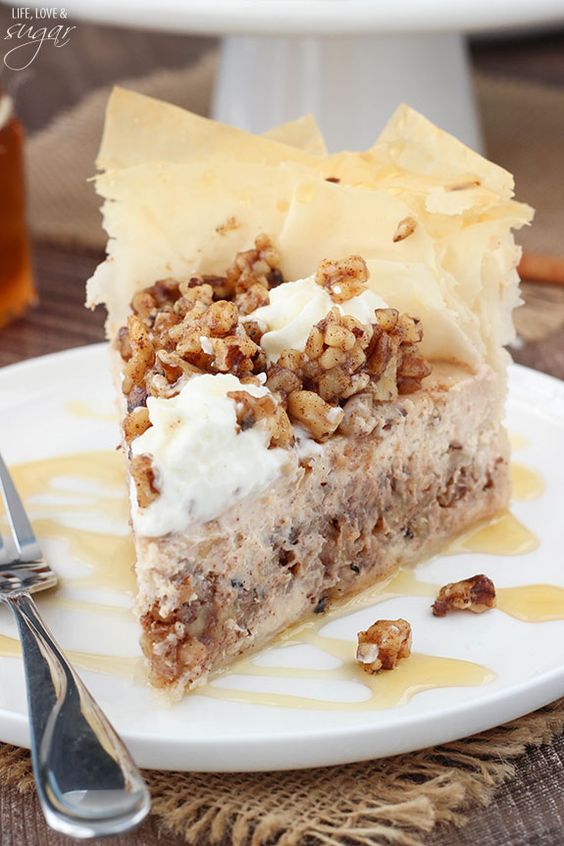 This Baklava Cheesecake is such a fun twist on the traditional Greek dessert. With all the flavors of cinnamon, honey and walnuts, it’s a fun way to mix together two delicious desserts into one! This Baklava Cheesecake is such a fun twist on the traditional Greek dessert. With all the flavors of cinnamon, honey and walnuts, it’s a fun way to mix together two delicious desserts into one!
