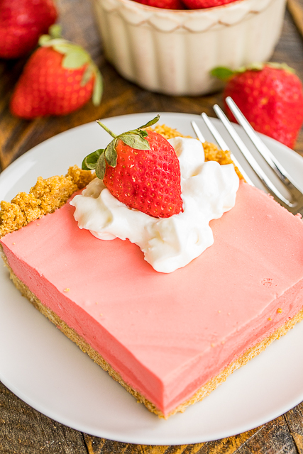No-Bake Strawberry Cheesecake Recipe - graham cracker crust, light and fluffy no-bake cheesecake - SO good. Seriously, THE BEST no-bake cheesecake EVER! Great with whipped cream and fresh strawberries. Strawberry jello, boiling water, strawberry juice, cream cheese, sugar, vanilla, evaporated milk, graham cracker crumbs, butter. Seriously delicious! Great make ahead dessert recipe for a crowd! #cheesecake #nobakedessert #dessert No-Bake Strawberry Cheesecake Recipe - graham cracker crust, light and fluffy no-bake cheesecake - SO good. Seriously, THE BEST no-bake cheesecake EVER! Great with whipped cream and fresh strawberries. Strawberry jello, boiling water, strawberry juice, cream cheese, sugar, vanilla, evaporated milk, graham cracker crumbs, butter. Seriously delicious! Great make ahead dessert recipe for a crowd! #cheesecake #nobakedessert #dessert