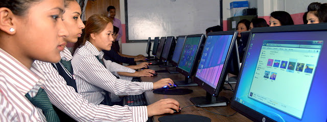 Texas International College Students in Computer Lab