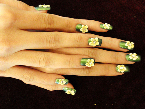 Green Nail Art with yellow Flowers