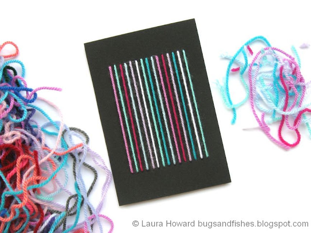 Use your leftover yarn to make stripey DIY notecards! Notecard decorated with yarn stripes