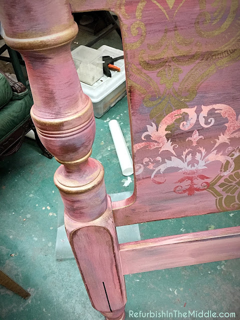 headboard with medallion stencils and shades of pink chalk paint