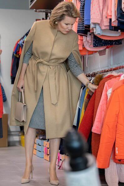 Queen Mathilde visited J and JOY in Waremme which is a clothing brand that is also socially and philanthropically active. Natan dress and camel cape