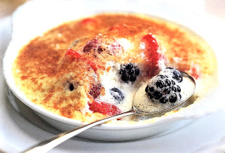 Berry Gratin: Mixed berries topped with a custard cooked under a grill and served in individual dishes