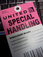 Pink and white tag that reads "United Special handling, Wheelchair Weight" with lines for wheelchair description