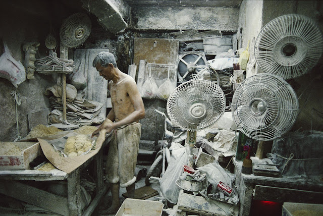 Noodle maker covered in flour - Noodle production supplied popular noodle restaurants in Kowloon.