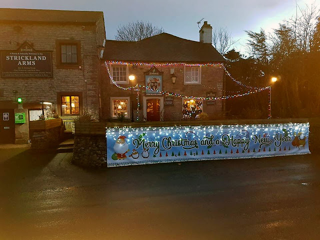 Strickland Arms Christmas banner with Santa, Penguins and a Reindeer