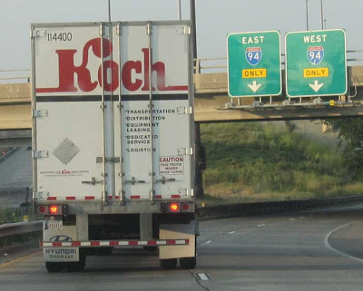Koch Trucking logo on a semi, sort of naive mid-20th century logo with loopy K and slab serifs