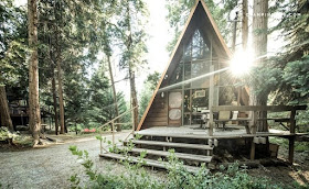 02-Front-Entrance-Glamping-Hub-A-Frame-House-Architecture-www-designstack-co
