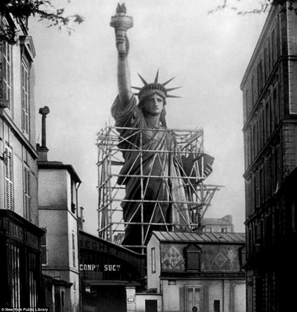 40 Unbelievable Historical Photos - The Statue of Liberty surrounded by scaffolding as workers complete the final stages in Paris. Circa 1885