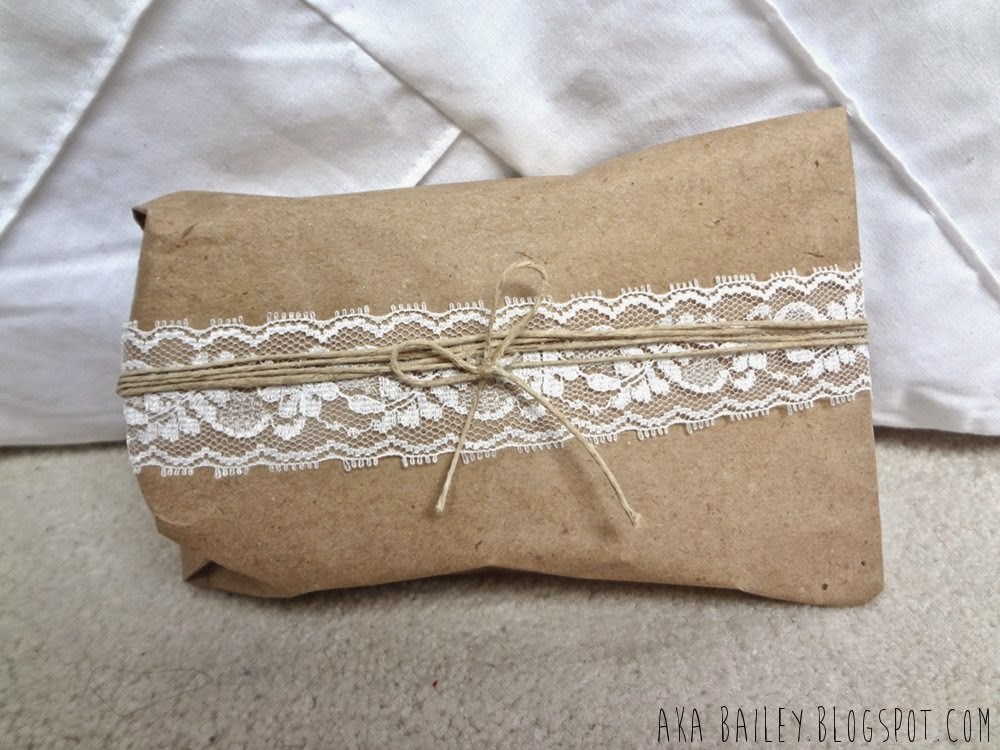 Brown paper gift wrap wrapped with lace and hemp twine
