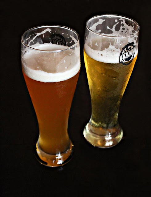two beer glasses full of beer