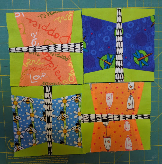 Four-inch butterfly blocks with tapered bodies.
