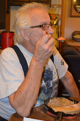 Dale Cools a bite before eating Photo by Trisha Field