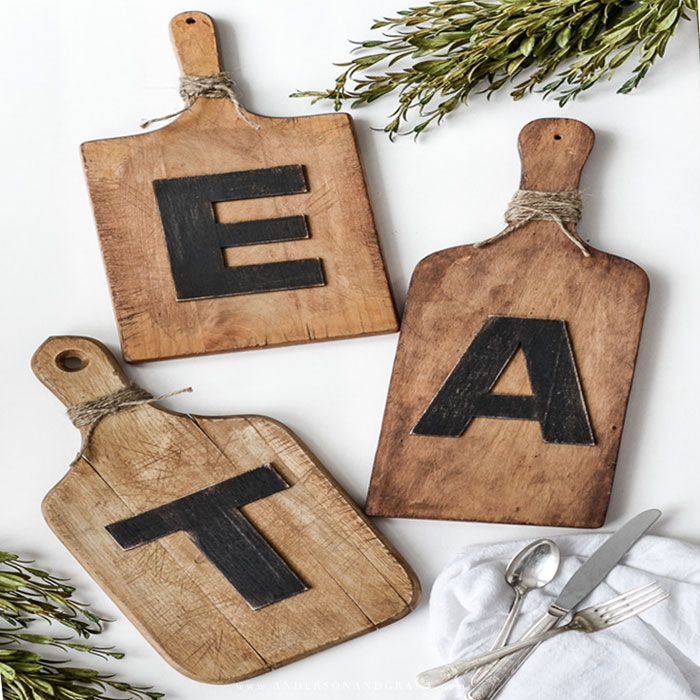 Repurpose thrift store cutting boards by turning them into farmhouse kitchen wall art. EAT Cutting Boards